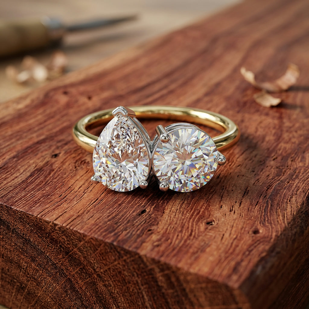 Toi et Moi pear and round brilliant diamond engagement ring on Australian hardwood — handcrafted in Byron Bay by Lucano