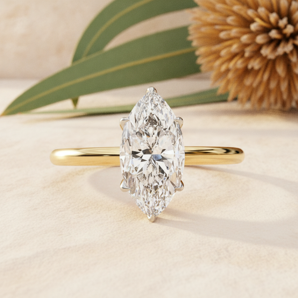 Platinum diamond engagement ring on warm sandstone with native banksia — handcrafted in the Byron Bay Hinterland by Lucano