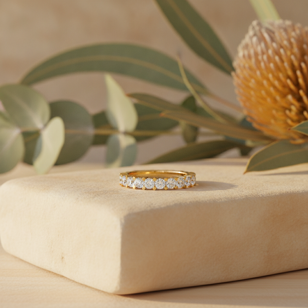 Diamond wedding band on warm sandstone with native banksia — handcrafted in the Byron Bay Hinterland by Lucano