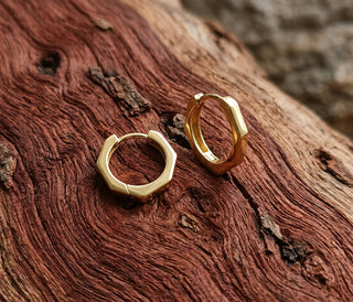 Bamboo Earrings - 9ct gold faceted hoop earrings on model - Lucano Byron Bay