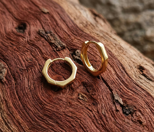 Bamboo Earrings - 9ct gold faceted hoop earrings on model - Lucano Byron Bay