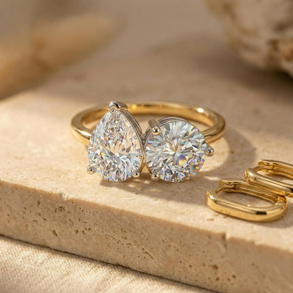 Toi et Moi Pear & Round Ring - pear and round brilliant diamond two-stone engagement ring on hand - Lucano Byron Bay