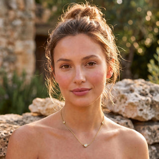 Stelle Trio bezel necklace worn at the collarbone