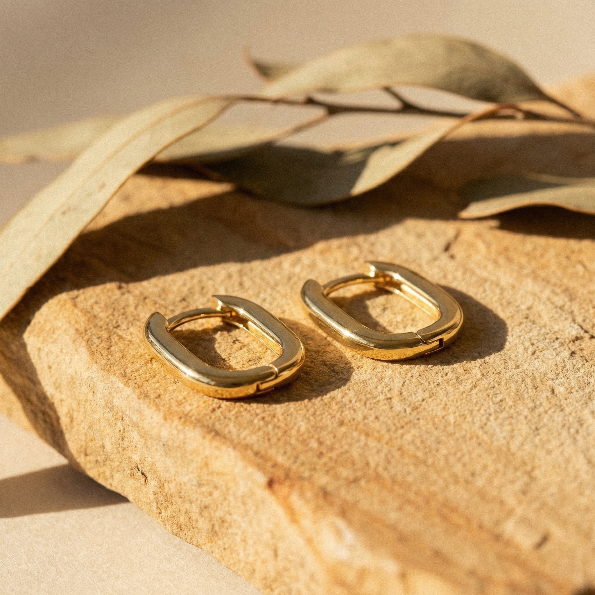 Huggie Earrings, gold huggie hoop earrings handcrafted by Lucano, Byron Bay, detail close-up
