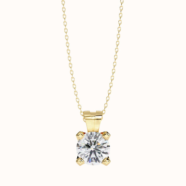Aurea round brilliant diamond solitaire pendant in gold, front view