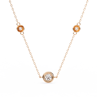 Stelle Trio bezel diamond necklace on a delicate gold cable chain