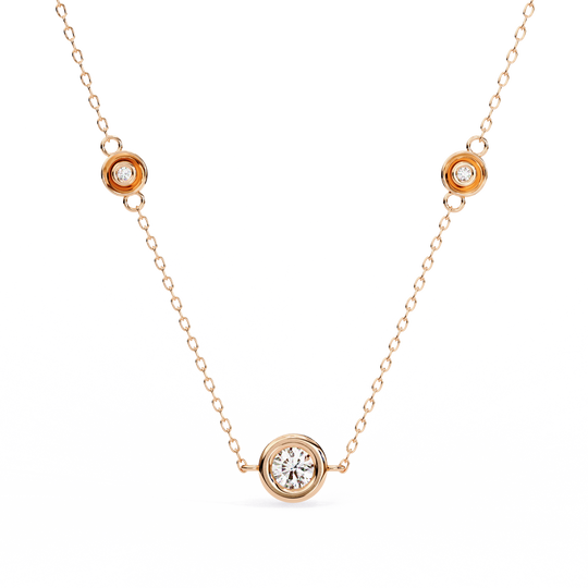 Stelle Trio bezel diamond necklace on a delicate gold cable chain
