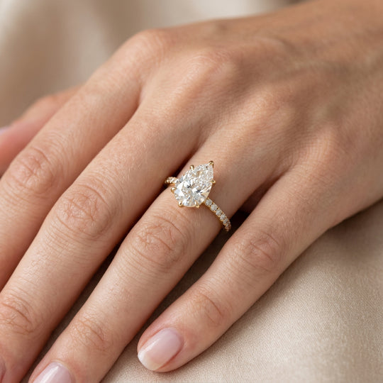 Mira Pear Pavé Solitaire - pear pavé engagement ring - angled view - Lucano