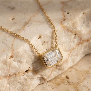 Imperia emerald-cut diamond pendant in gold worn at the collarbone