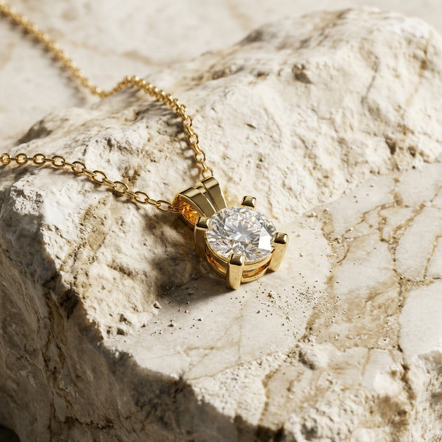 Aurea diamond solitaire pendant worn at the collarbone