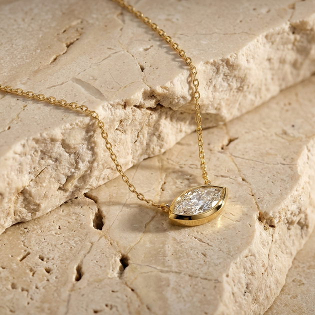 Navette marquise diamond pendant worn at the collarbone