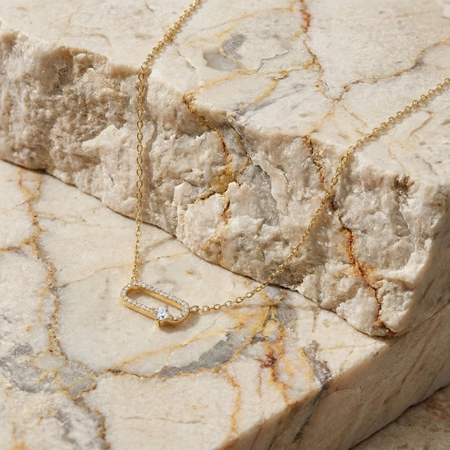 Catena pavé link diamond pendant necklace in gold worn at the collarbone
