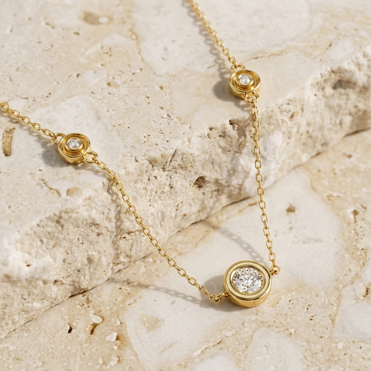 Stelle Trio diamond necklace showing the three bezel-set stones along the chain