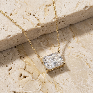 Imperia radiant-cut diamond pendant in gold worn at the collarbone