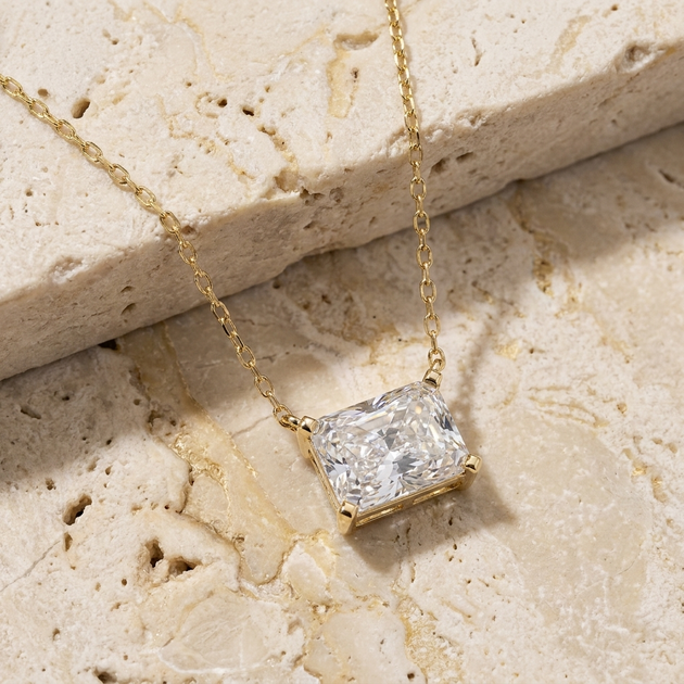 Imperia radiant-cut diamond pendant in gold worn at the collarbone